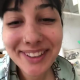 From under the toilet, a very cute girl pushes out a hanging log that drops, then pisses over the product. Filmed from a between the legs perspective. Vertical format video. About a minute.